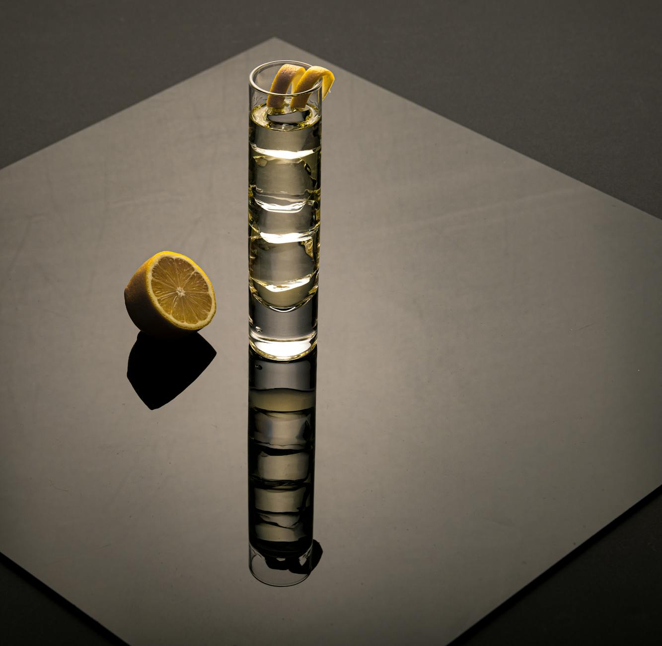 COLLINS: meaning a tall slender highball glass