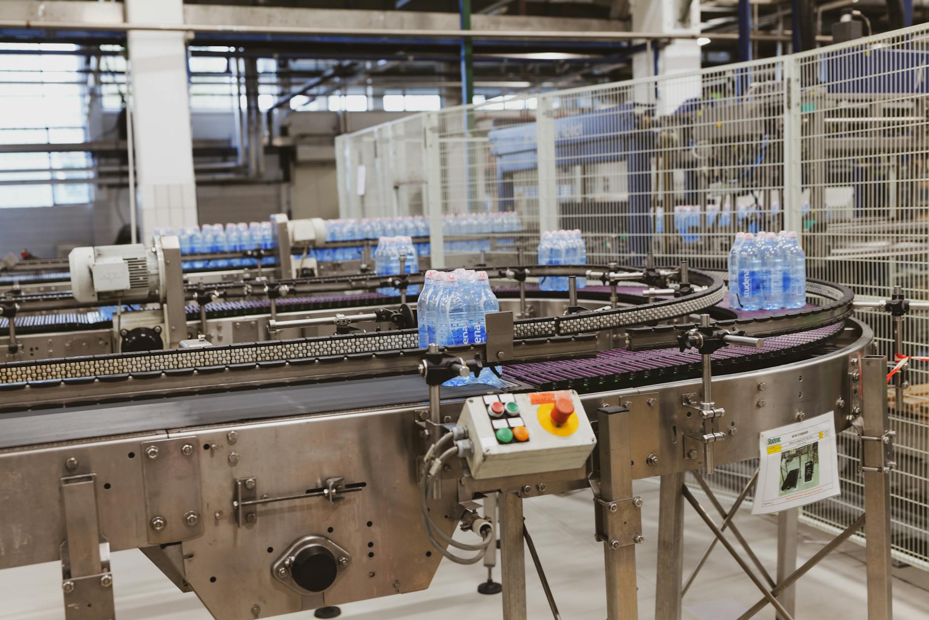 ASSEMBLY LINE — a manufacturing system where items move along a conveyor