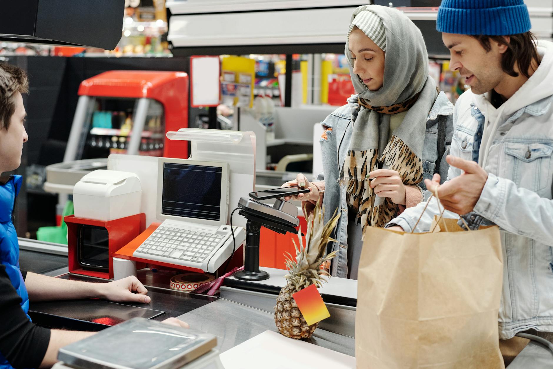 CHECKOUT LANE — a store checkout area where items move on a belt