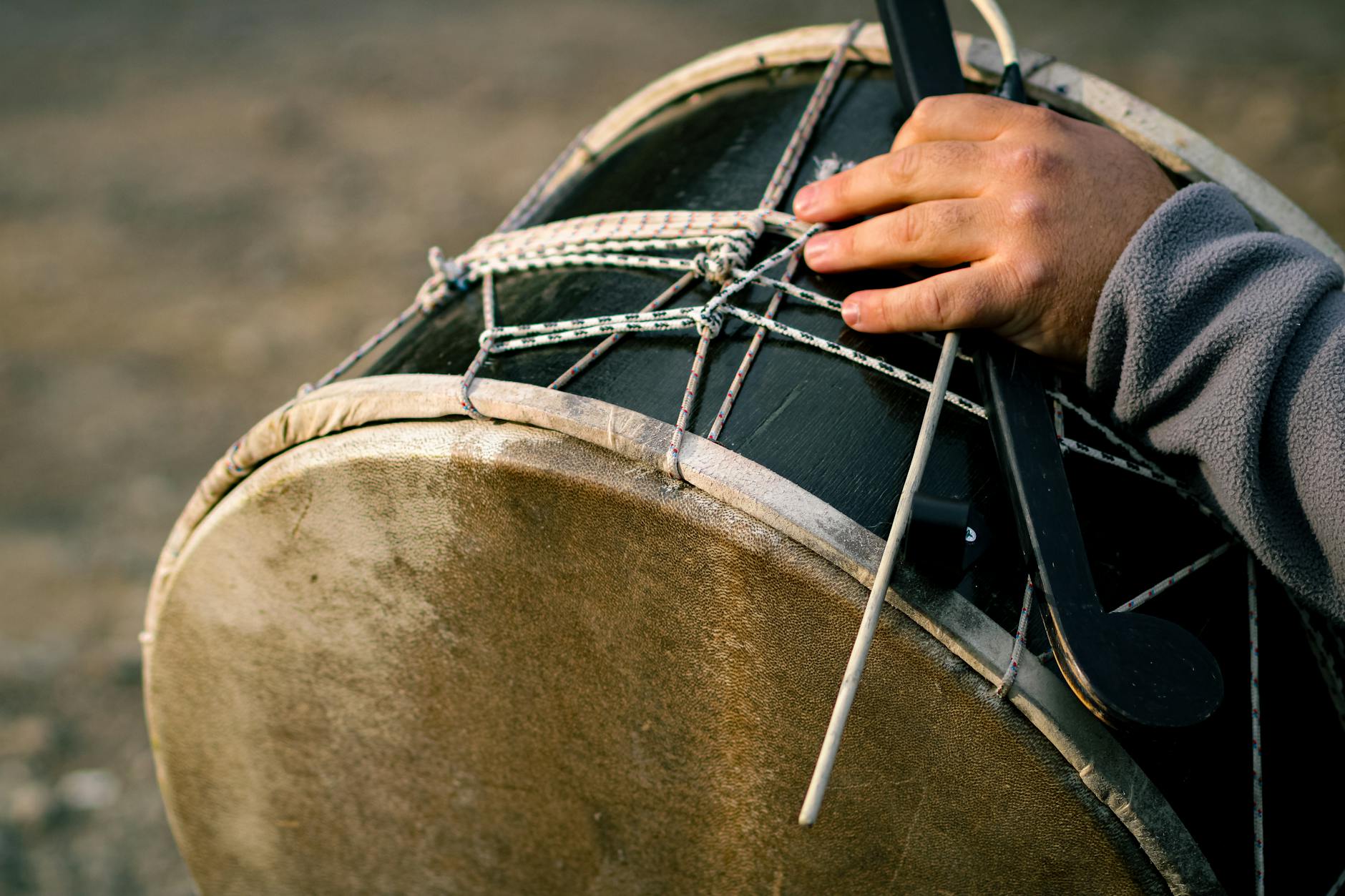 DRUM — a percussion instrument used to make rhythmic sounds