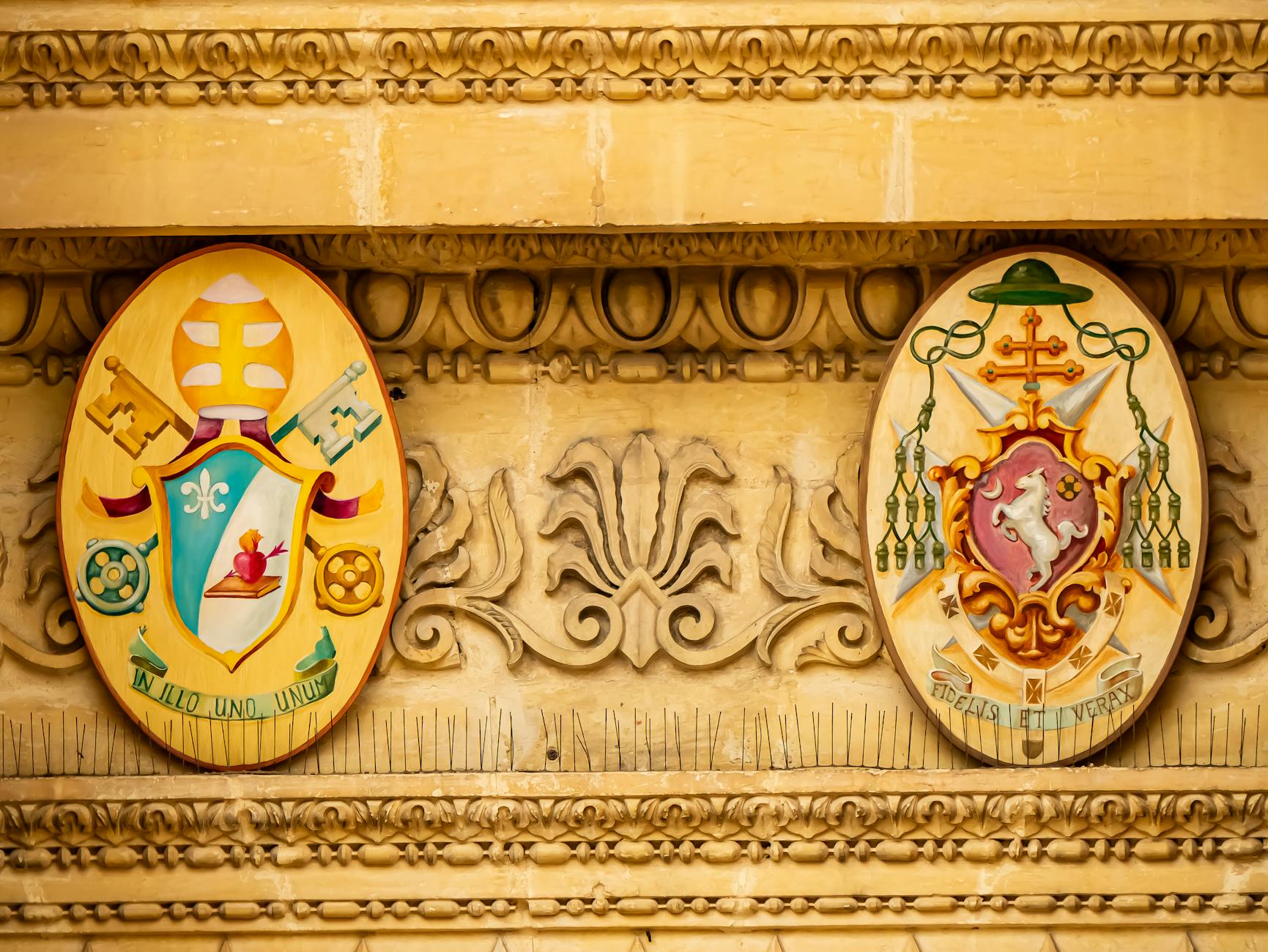 COAT OF ARMS meaning a heraldic design representing a family or entity