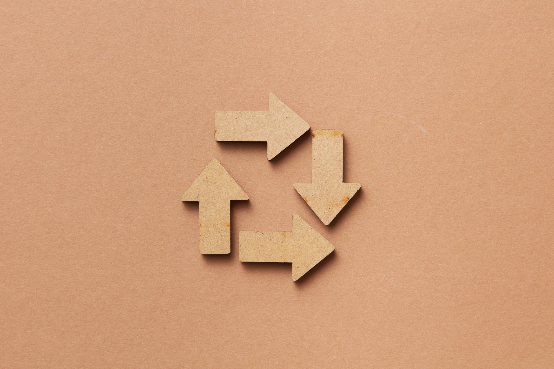 RECYCLING — the recycling arrow icon shown on a bin or container.