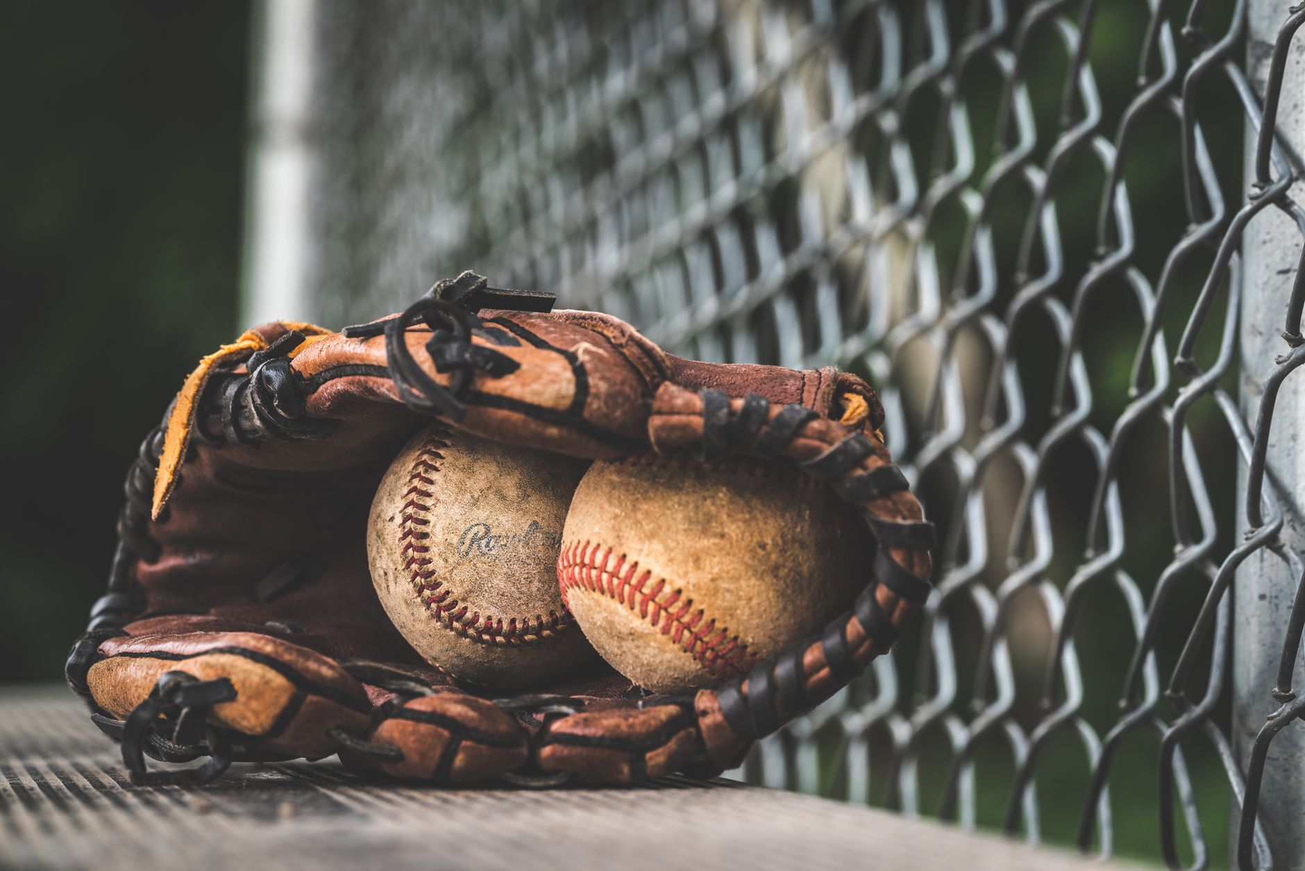 Baseball glove meaning a fielding glove with visible laces shown close-up