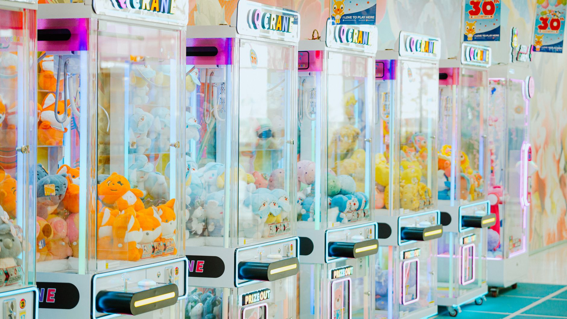 CRANE GAME meaning a claw machine game where you try to grab prizes