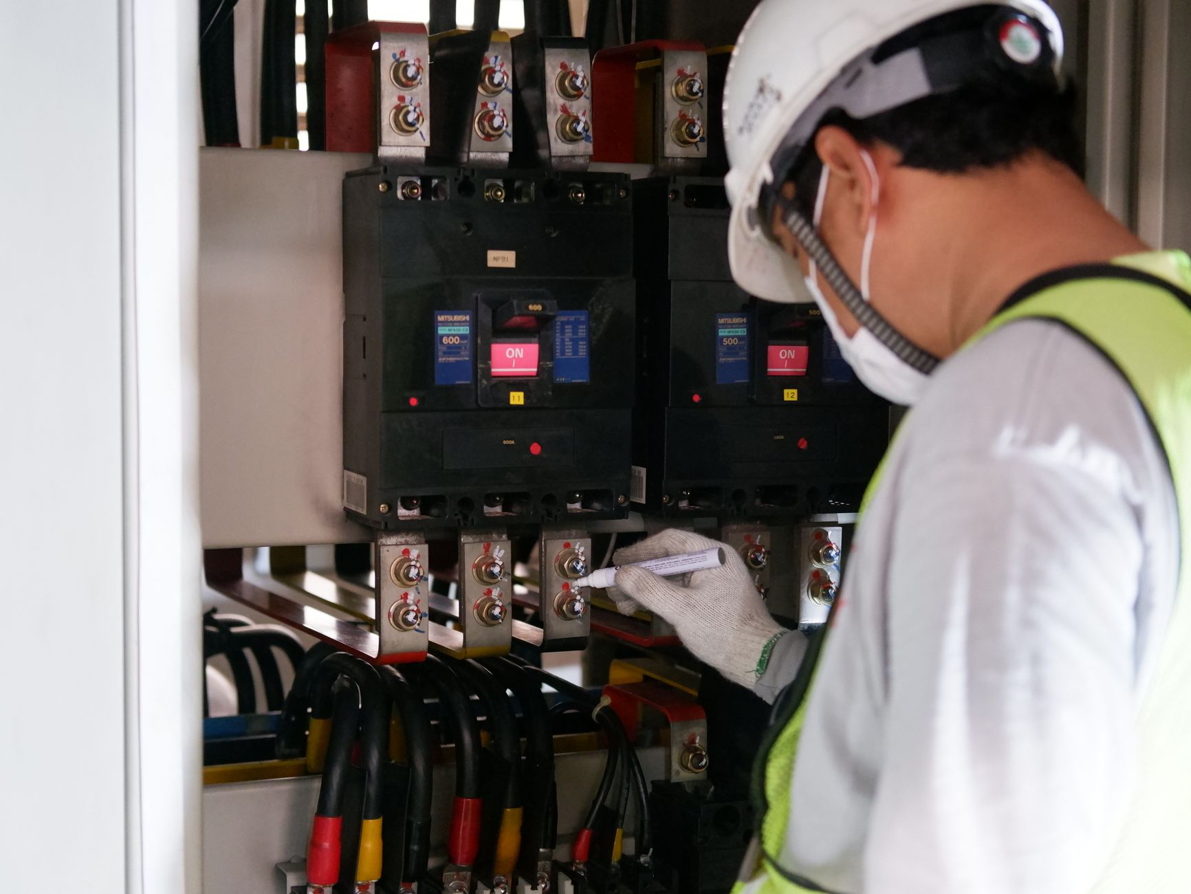 BREAKER: an electrical switch that trips to stop current during overloads