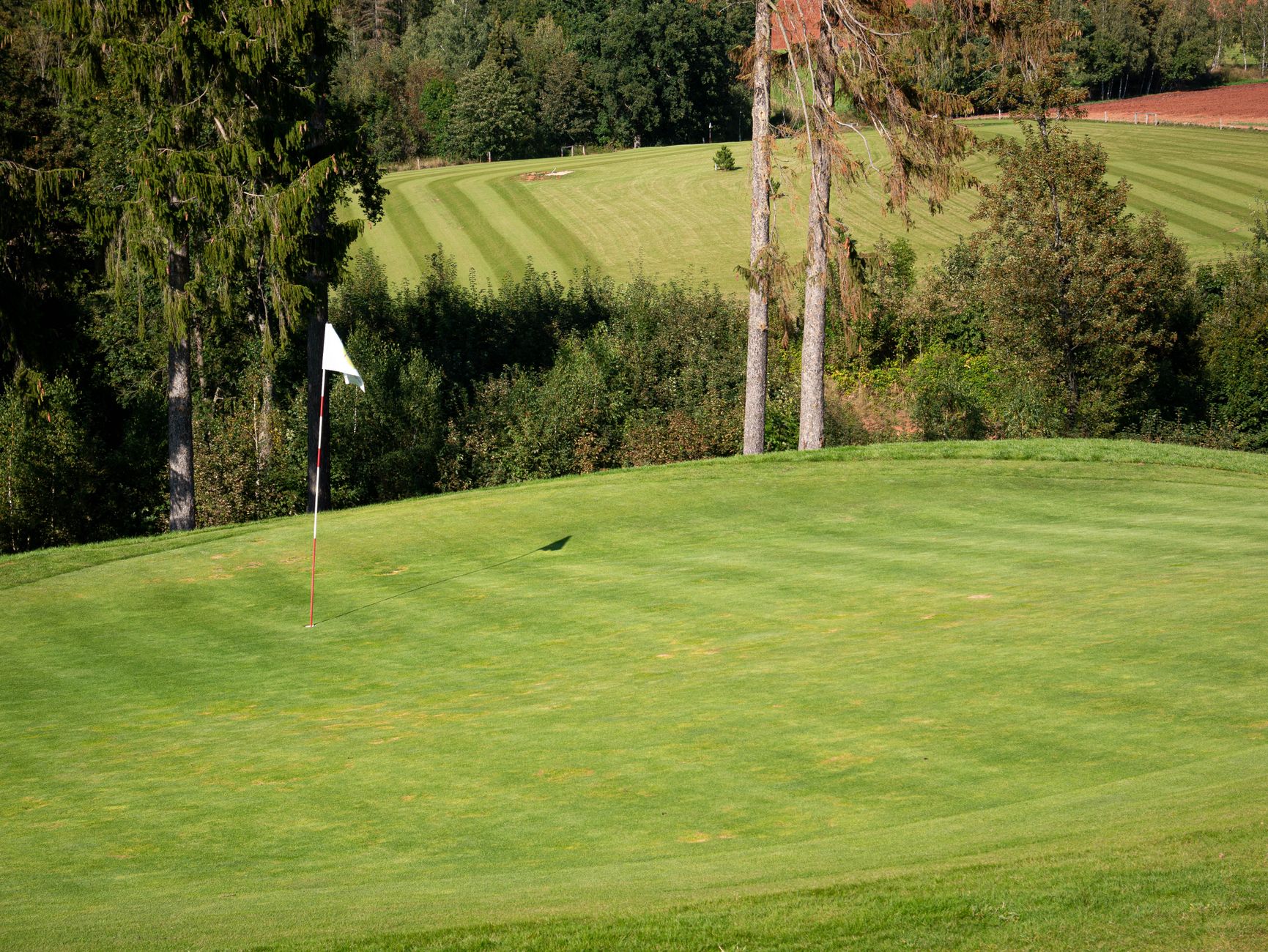 HOLE: a single marked playing area on the course