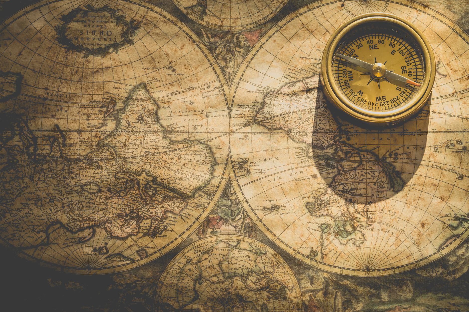 CHANGE TACK meaning to change your strategy or approach shown with a compass turning to a new direction