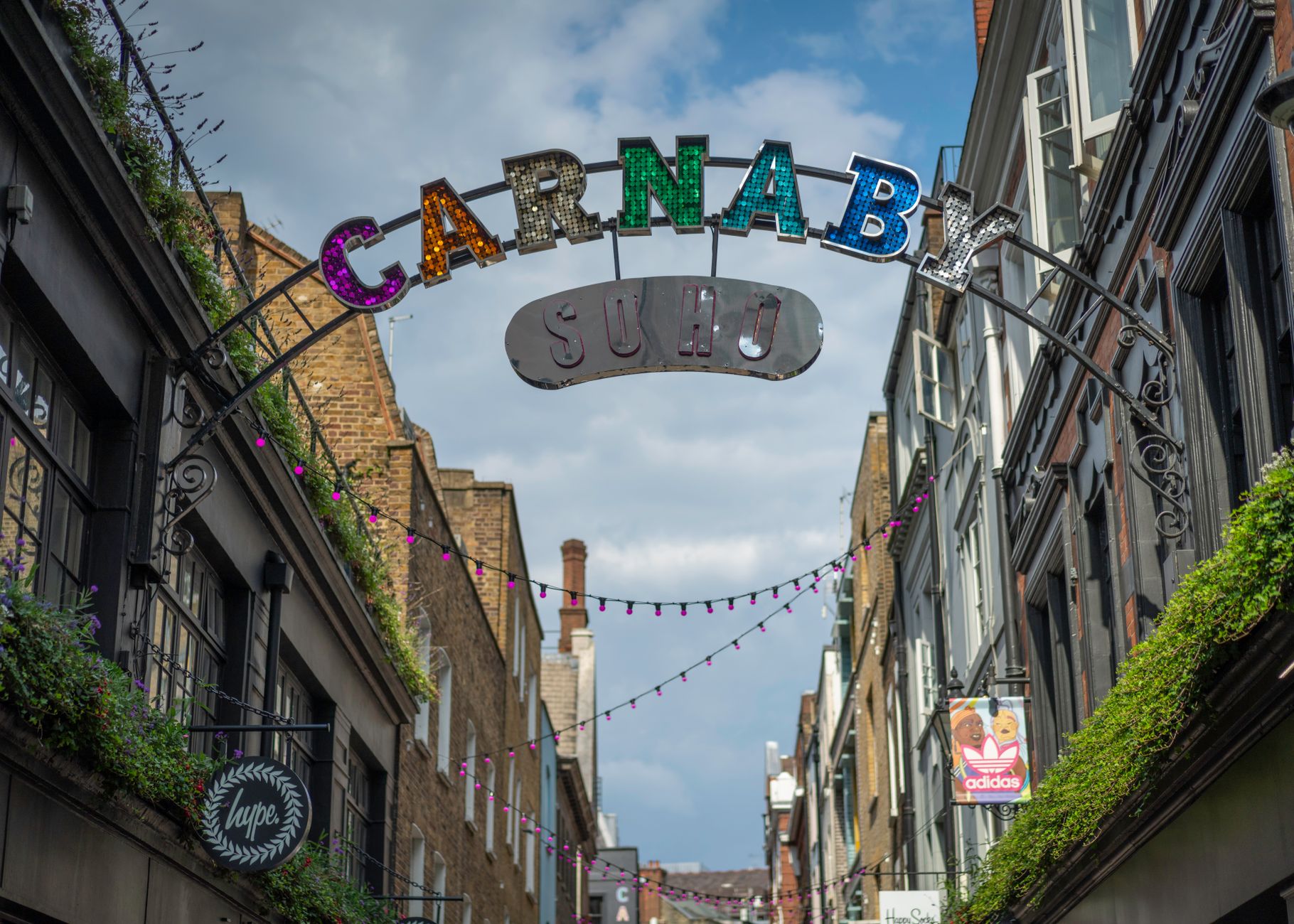 CARNABY STREET meaning a famous shopping street in London associated with that era